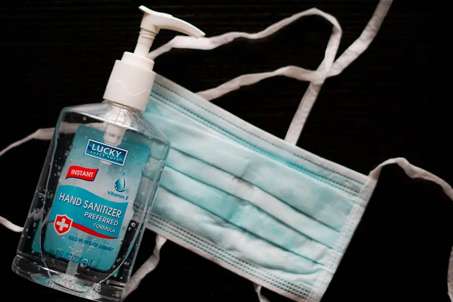 image of hand sanitizer and mask